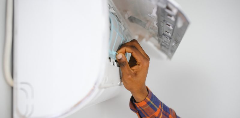 AC Electrician Technician Repairing Air Conditioner Appliance