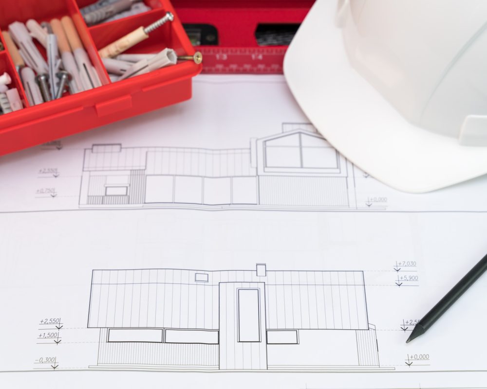 Construction design documentation and tools on the table